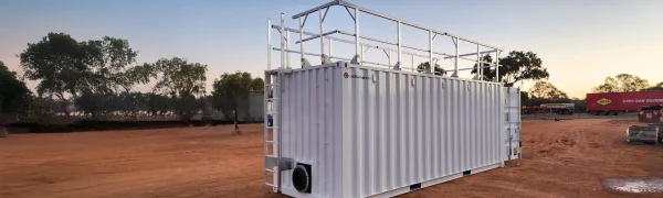 Chemical and dangerous goods storage container with integrated non-slip access steps and guardrails