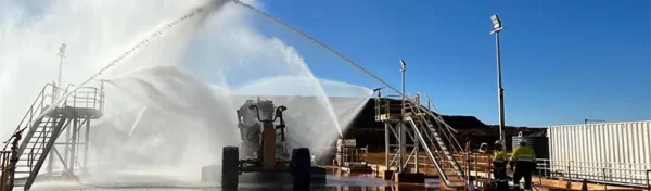 Close-up of Liquimech wheel wash spray nozzles removing mud and gravel from tyres at site