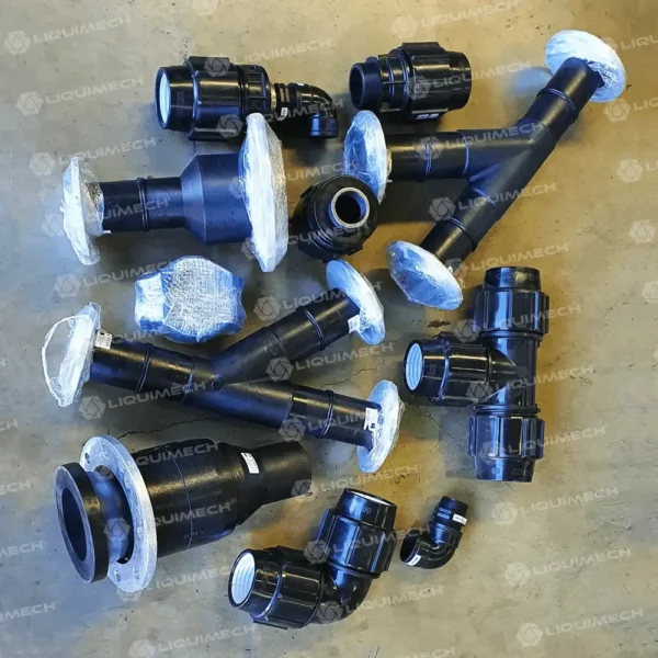 Durable Liquimech pipe fittings featuring T-connectors and elbow joints for redirecting pipe flow in civil and mechanical setups.