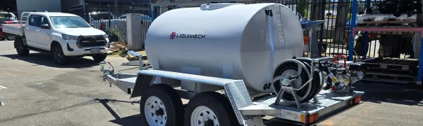 Firefighting trailer water pump motor with protective casing for durable operation in harsh environments.