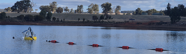 Floating Suction Device installed on a dam providing cleaner water intake for pump water transfer and mine dewatering applications