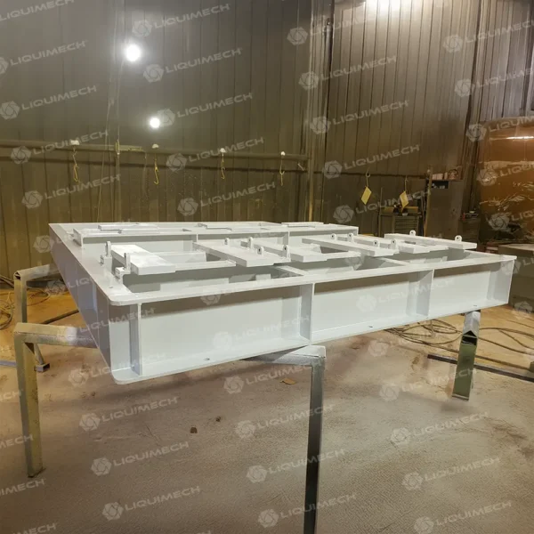 Heavy-duty skid for pumps in workshop, designed for assembly, testing, and industrial applications by Liquimech