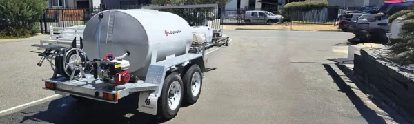 Heavy-duty towing hitch and stabilizer bar on firefighting trailer designed for safe transport over uneven terrain.