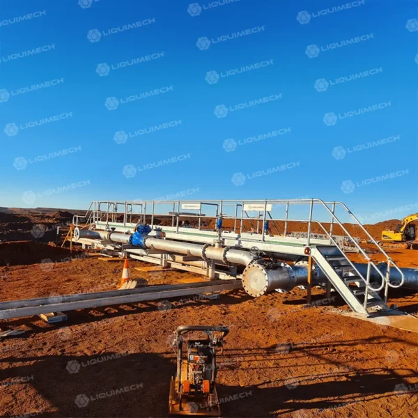 Liquimech heavy-duty pipe walkway access system with anti-slip surface and guardrails for safe worker access over pipelines