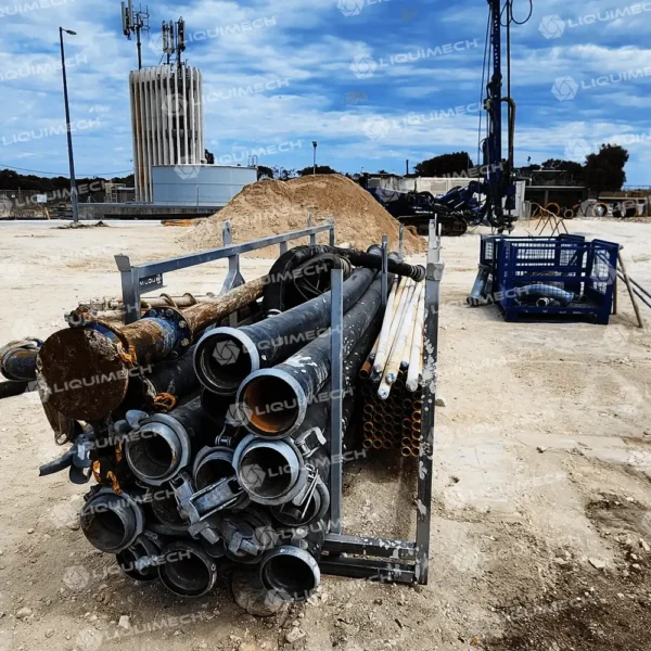 Liquimech stackable storage racks for hoses and pipes on large-scale job sites.