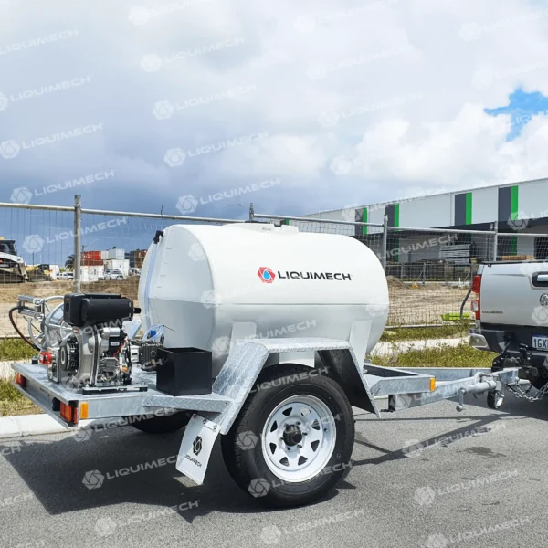 Liquimech trailed pressure washer unit in use cleaning park pathways and public infrastructure