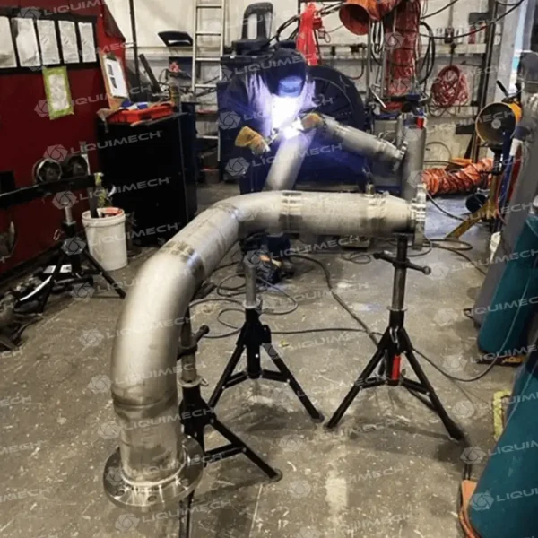 Liquimech workshop-fabricated piping spool sections arranged for dimensional and weld quality inspection