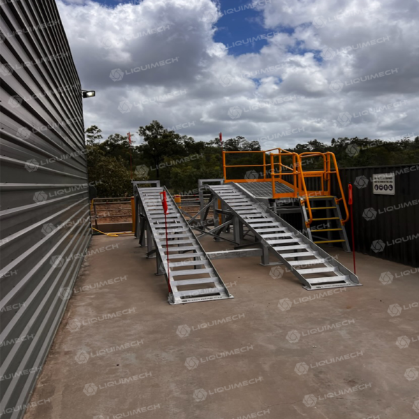 Portable truck wheel wash system with safety handrails for secure site operation Liquimech