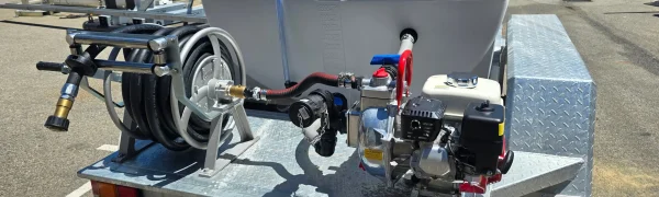 Retractable hose reel with firefighting hose extended, ready for rapid deployment.