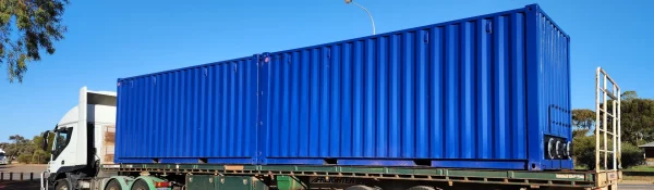 Secure chemical storage unit with bunded base for spill containment and hazardous material protection.